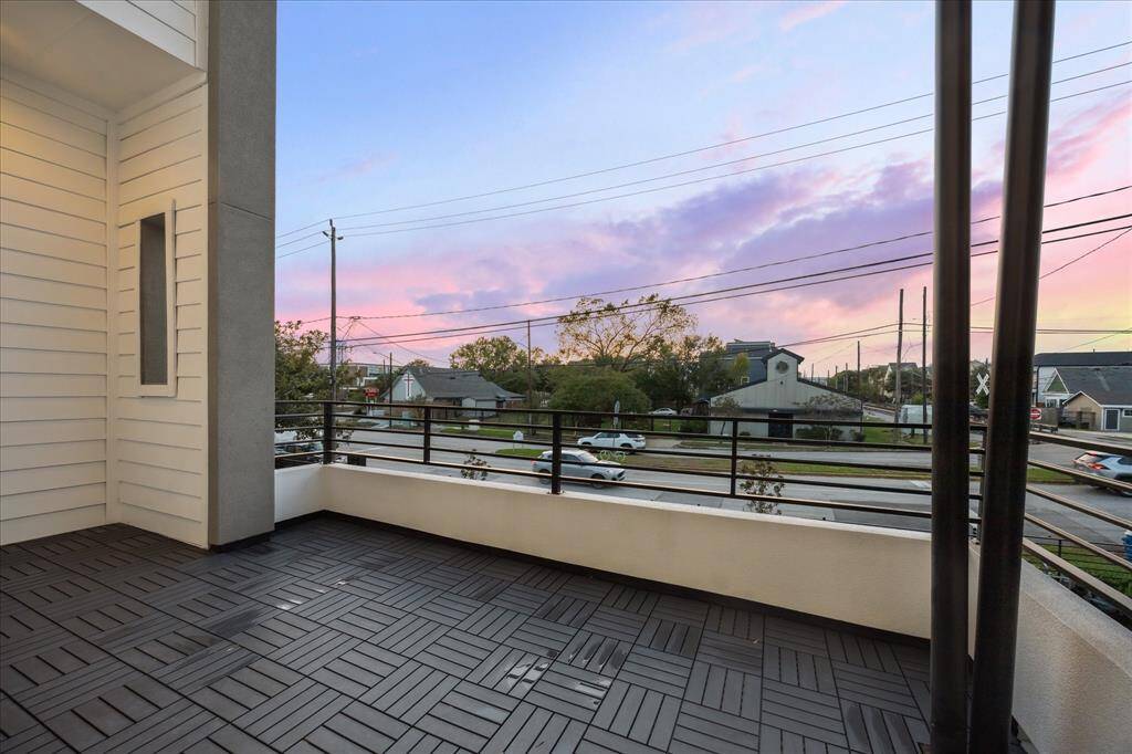 Relax on this spacious private balcony with comfortable seating and stunning sunset views. Perfect for outdoor dining or evening relaxation, this balcony provides a peaceful escape with panoramic views of the neighborhood.