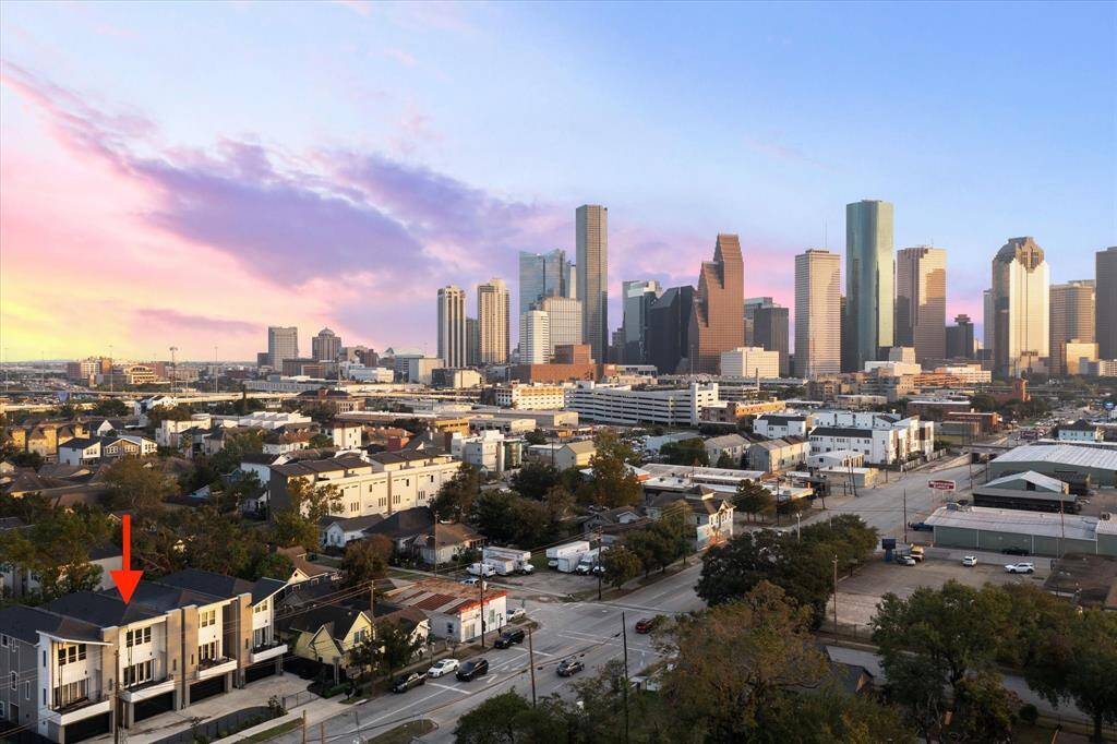 Enjoy sweeping views of the iconic Houston skyline from your very own balcony. This perspective perfectly captures the vibrant energy of downtown living, where city lights create a stunning evening backdrop and mornings offer peaceful sunrises over the cityscape.