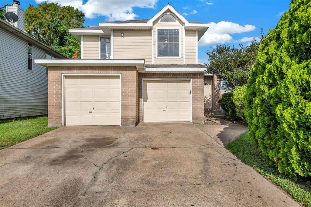 This home features a two-car attached garage along with a spacious private driveway, offering plenty of parking and convenience.