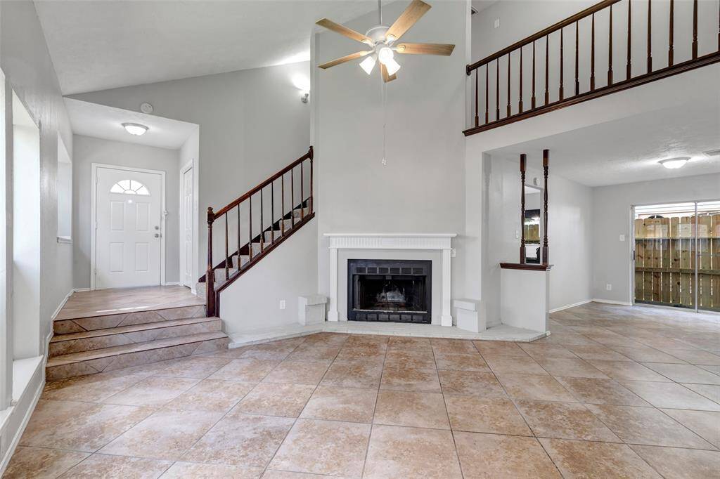 As you enter the home, you are welcomed into the living room, a central space designed for comfort and daily living.
