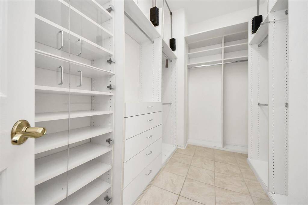 Here’s one of the two walk-in closets—there’s so much space to store everything you need and keep things organized!