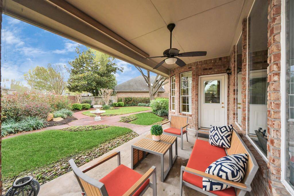 There’s also a nice covered patio with a ceiling fan, providing a comfortable outdoor space. With so much room in this yard, it’s perfect for entertaining, relaxing, or enjoying the outdoors!