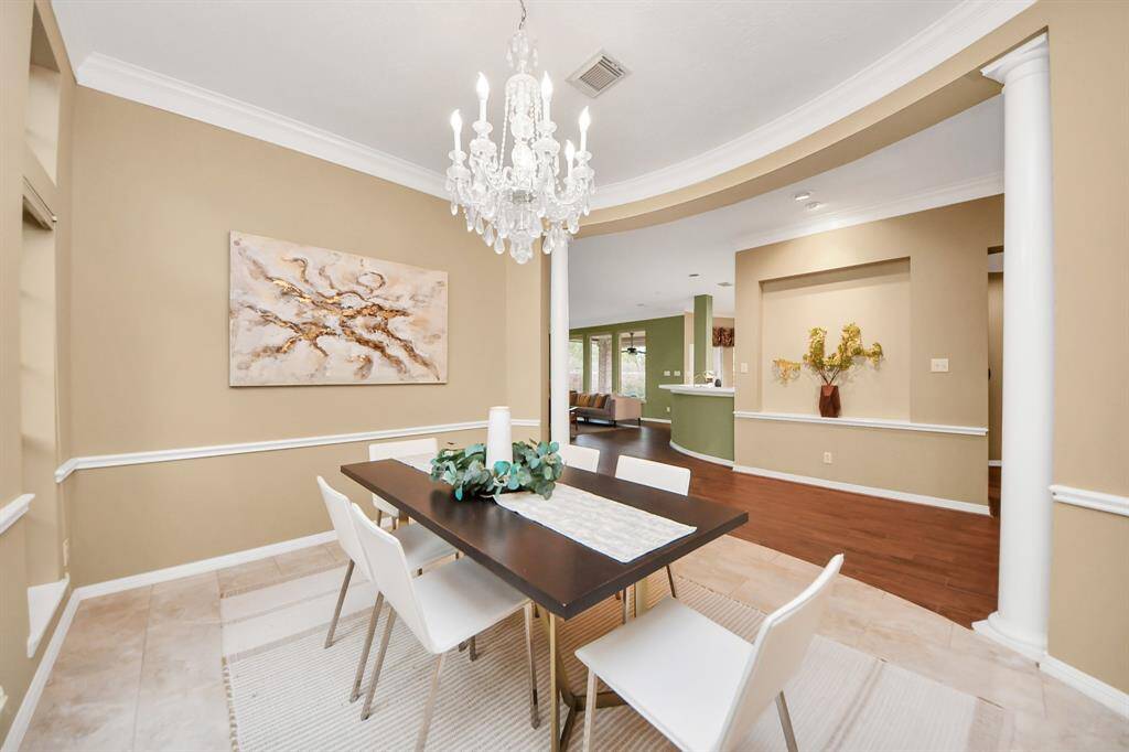 From this angle, you get a peek into the living room area and kitchen, giving you a glimpse of the home's open and inviting layout.