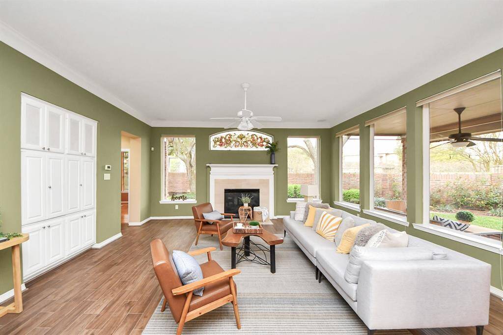 Who doesn’t love natural light? This living room is filled with it, surrounded by large windows that let in plenty of sunshine while you enjoy the beautiful backyard view.