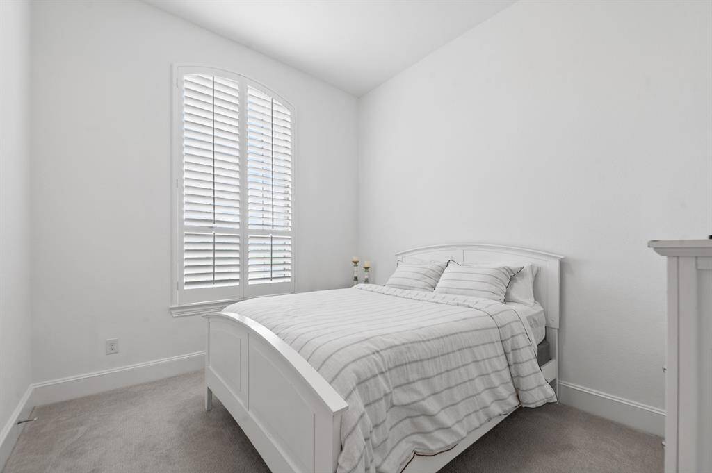Convenient downstairs bedroom, ideal for guests or flexible living space, with easy access and plenty of natural light.