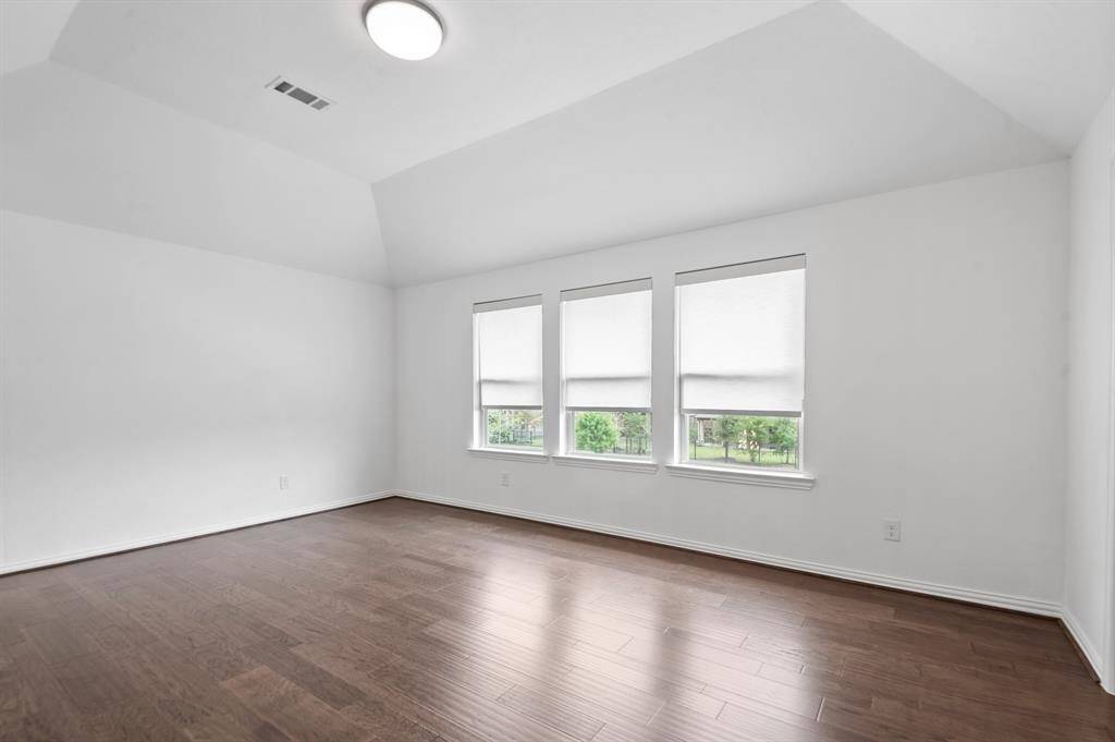Spacious upstairs game room, perfect for entertainment or relaxation, with plenty of room for activities and customization