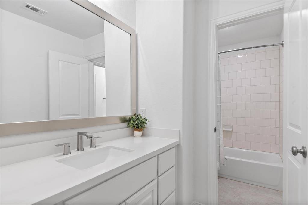 Jack & Jill bathroom with dedicated sinks for each bedroom
