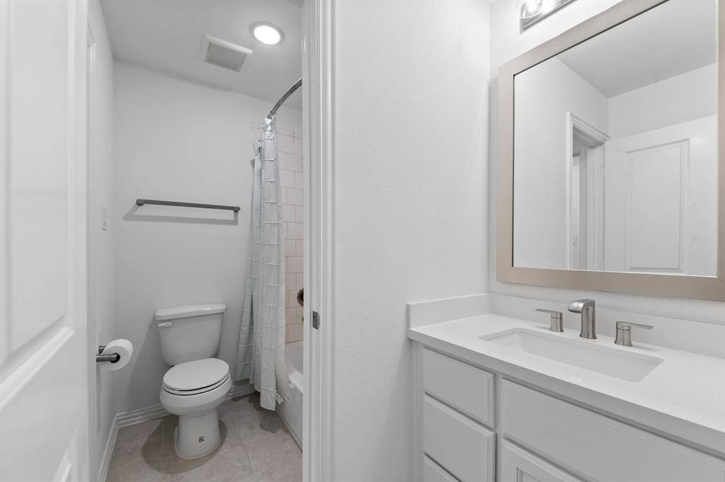 Jack & Jill bathroom with dedicated sinks for each bedroom