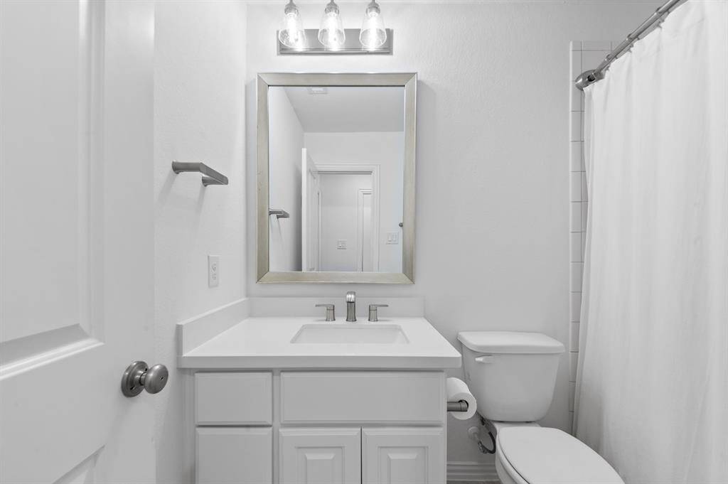 Private ensuite bathroom, featuring stylish finishes and a functional layout, providing a serene retreat just off the bedroom