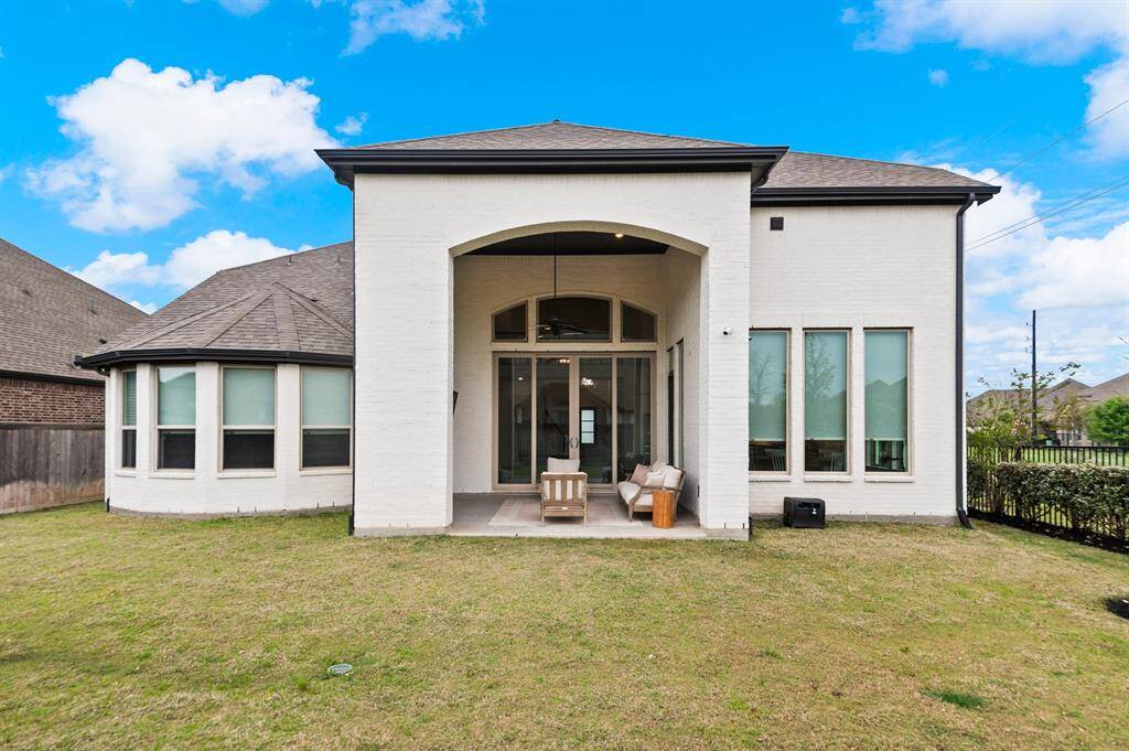Covered patio, providing a perfect outdoor retreat for relaxation or entertaining, rain or shine