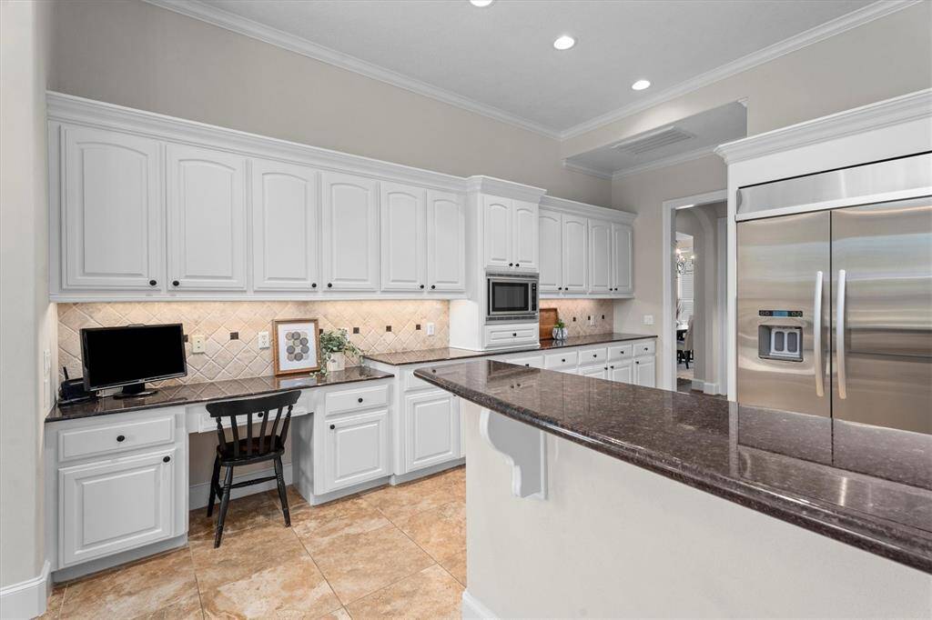 The built-in Stainless Steel refrigerator remains