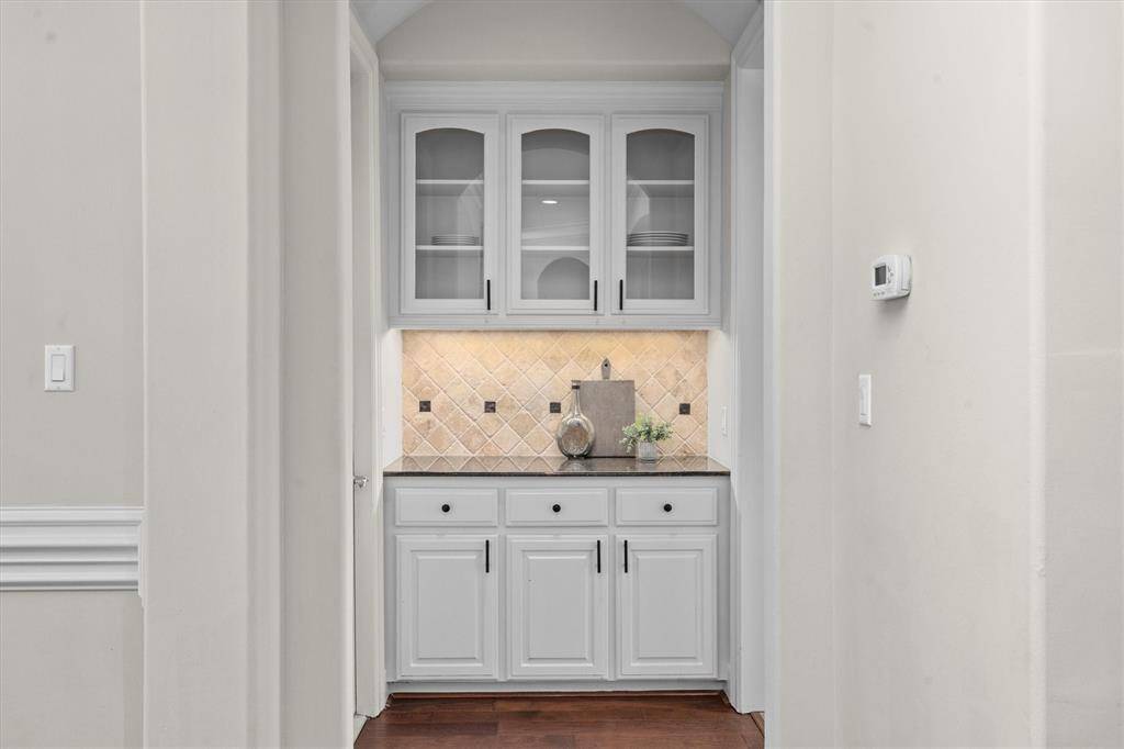 Butler pantry perfect as a wine or bar area flanking the formals and kitchen