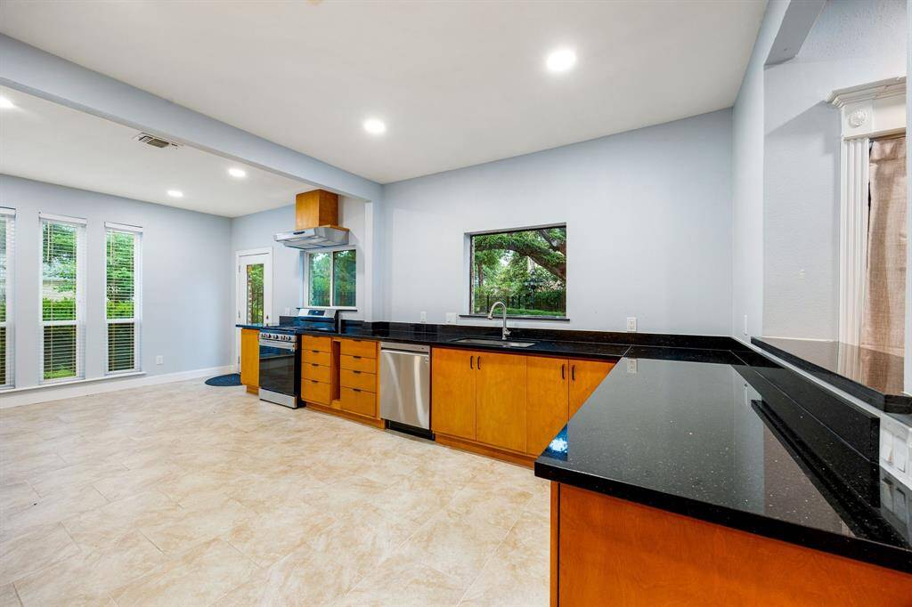 Expansive countertops provide ample space for meal prep, serving, and entertaining.