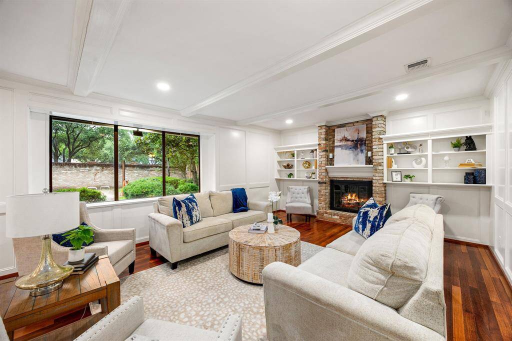 The living room is filled with natural light, creating a warm and inviting atmosphere throughout the day.