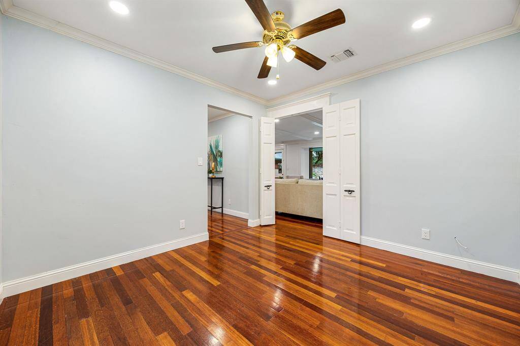 The office is perfectly situated between the living room and formal dining room, offering a convenient transition space for work or study.