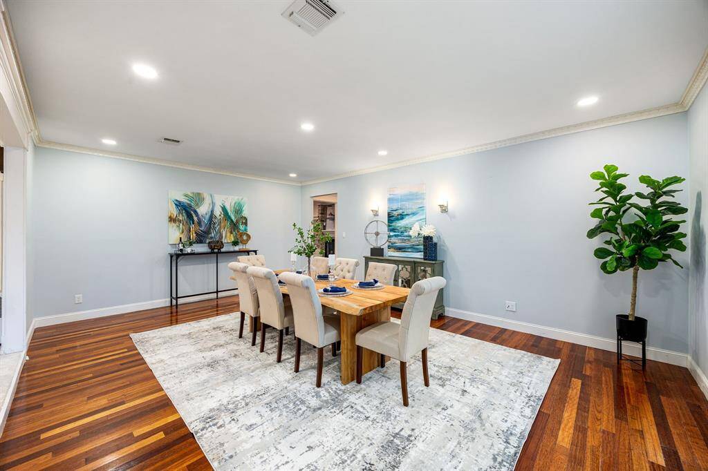 The formal dining room offers generous space, making it ideal for hosting large gatherings and special occasions.