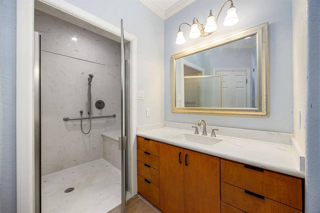 The bathroom features two separate sinks, providing plenty of space for morning routines and personal comfort.