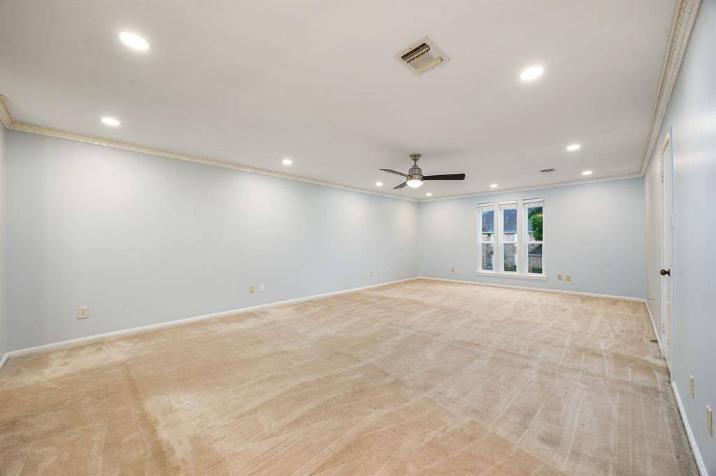 Designed as a game room, this spacious area provides the perfect setting for family and friends to gather and have fun together.