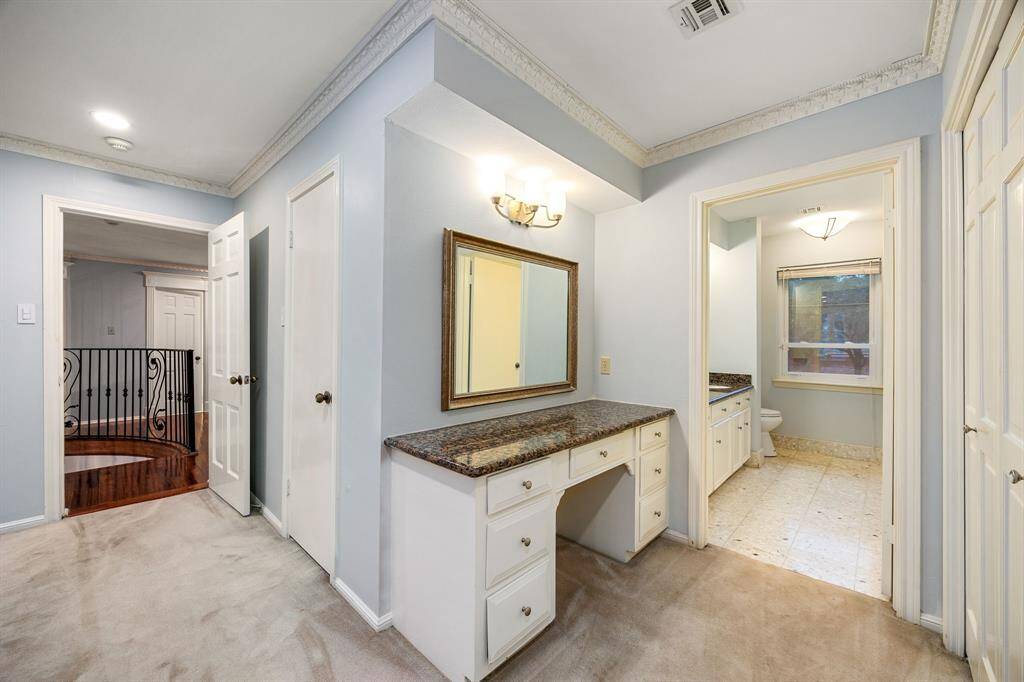 The game room upstairs features a full bath, providing added convenience for guests and family during gatherings or long play sessions.