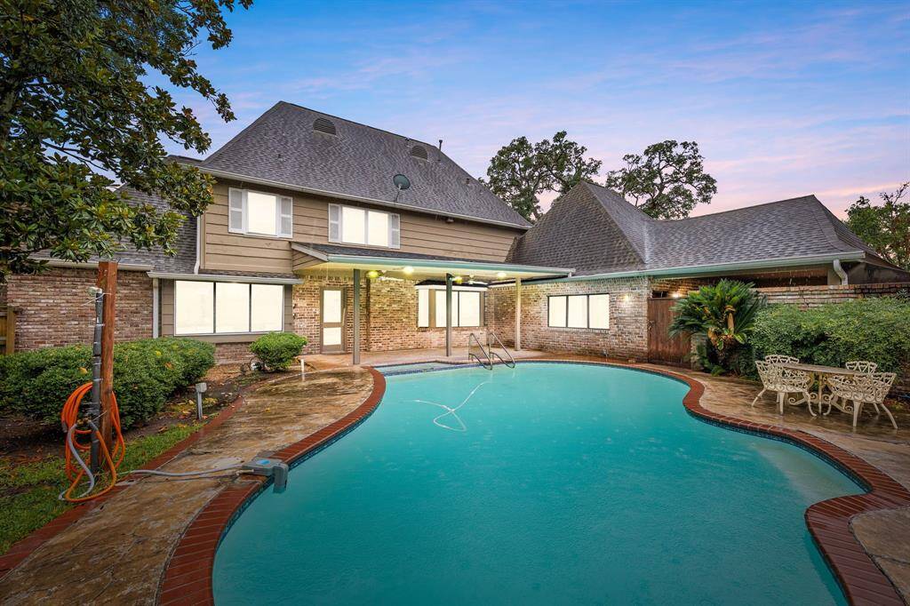 The backyard is a true oasis, perfect for relaxing and entertaining year-round.