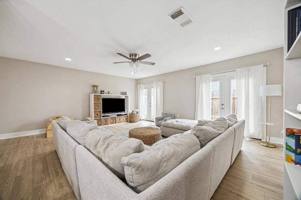 Another view of the living room.  There are two sets of french doors to allow in tons of natural light.