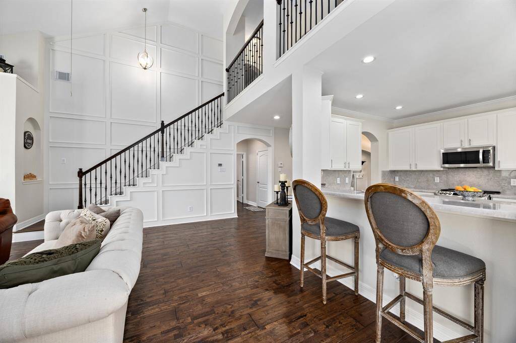 The kitchen seamlessly flows into the living room via the bar.