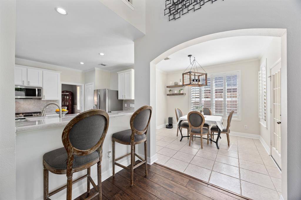 Spacious breakfast nook offers additional seating to the dining room and breakfast bar.