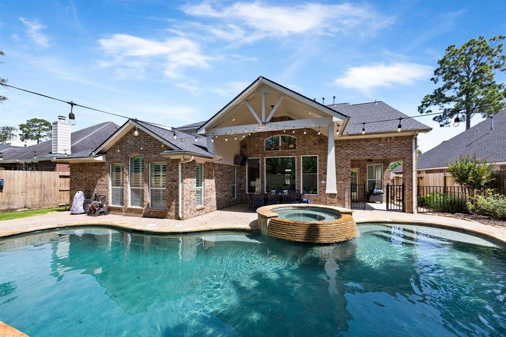 Sparking pool and spa, no back neighbors, and spacious covered patio make this home the perfect entertaining space year-round.