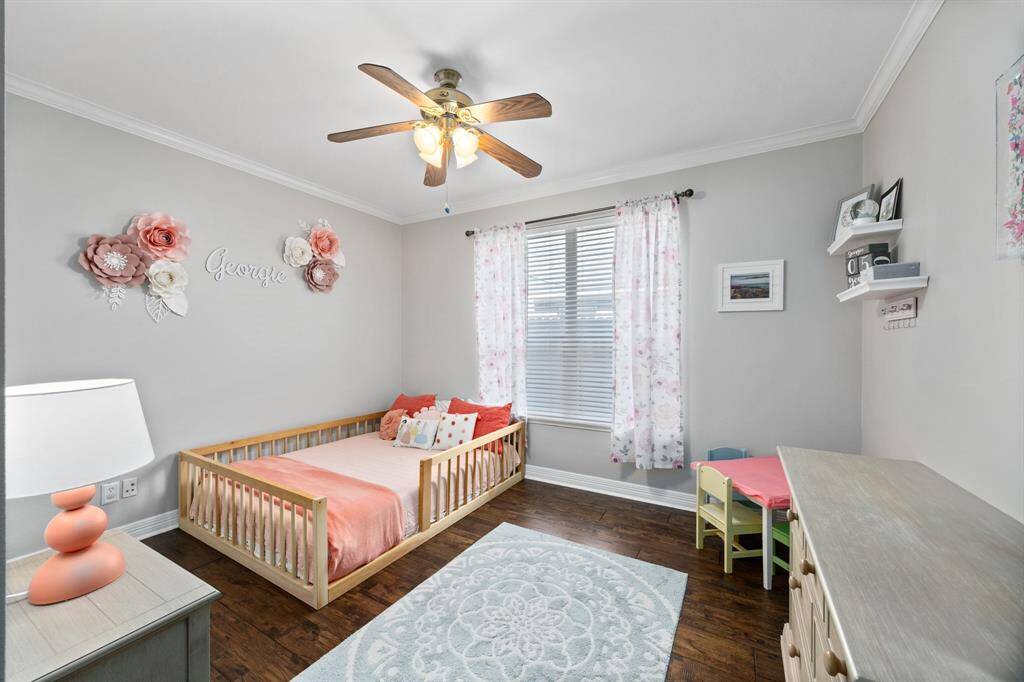 Secondary bedroom with a closet is located downstairs and can also be used as an office or bonus space.