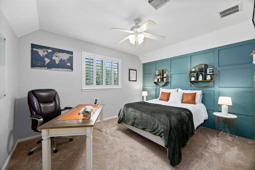 Bedroom #4 with custom millwork accent wall connects to the jack and jill bathroom.