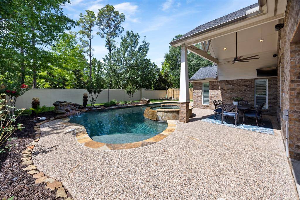 Gorgeous backyard with no back neighbors includes two covered porches for entertaining year-round.