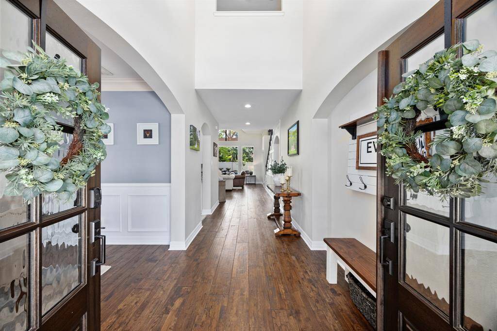 Stunning wood floors throughout the first floor draw you into the gracious entry.