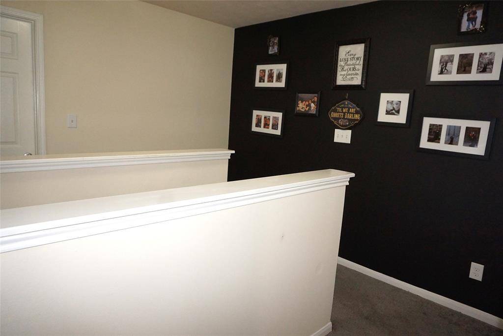 The two front secondary bedrooms are separate from the primary bedroom located to the back of the home.