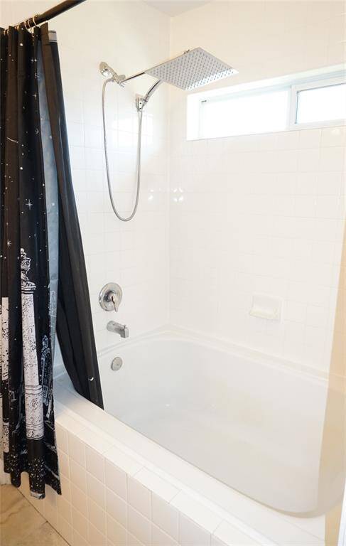Large soaking tub/shower combo perfect for a relaxing retreat after a busy day!