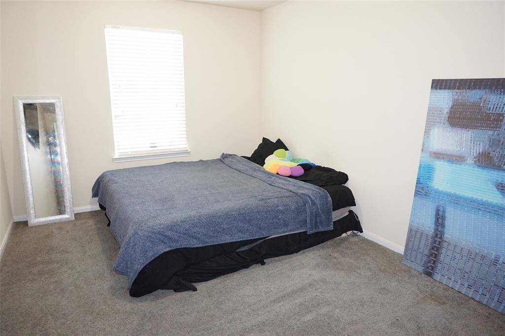 One of the secondary bedrooms (approximately 13 x 10) with a generous closet.  A king-sized bed will definitely fit!