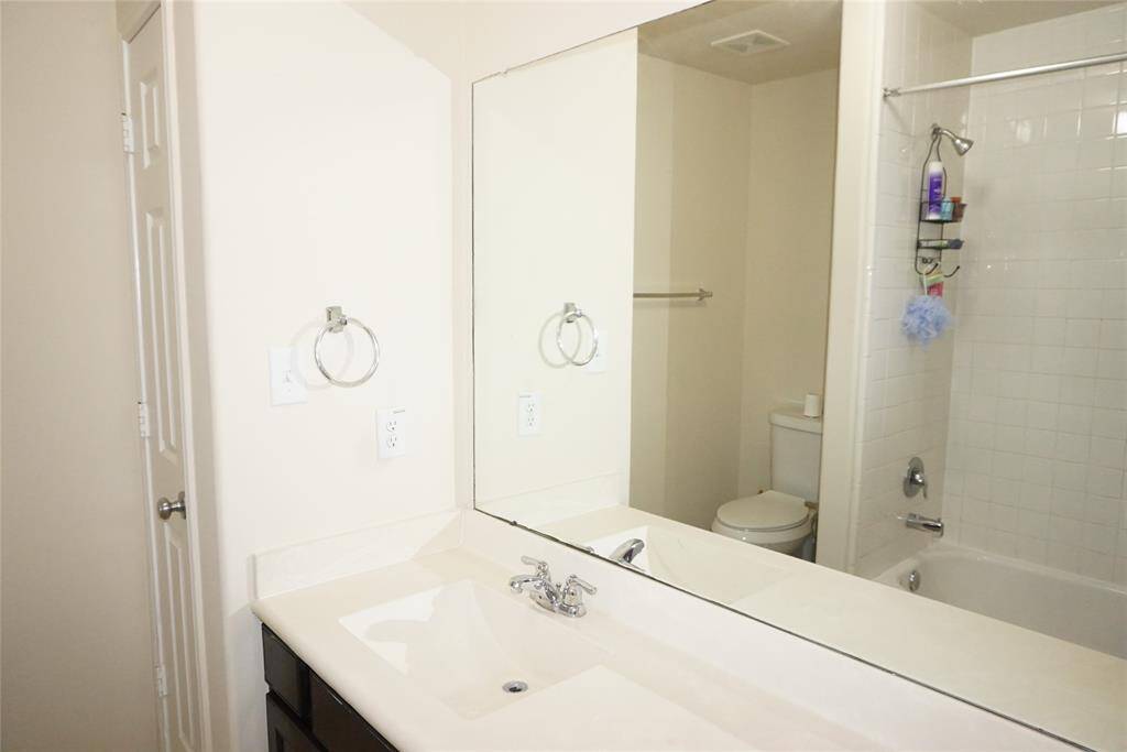 Secondary bath with tub/shower combo, one sink with a long vanity AND a linen closet!