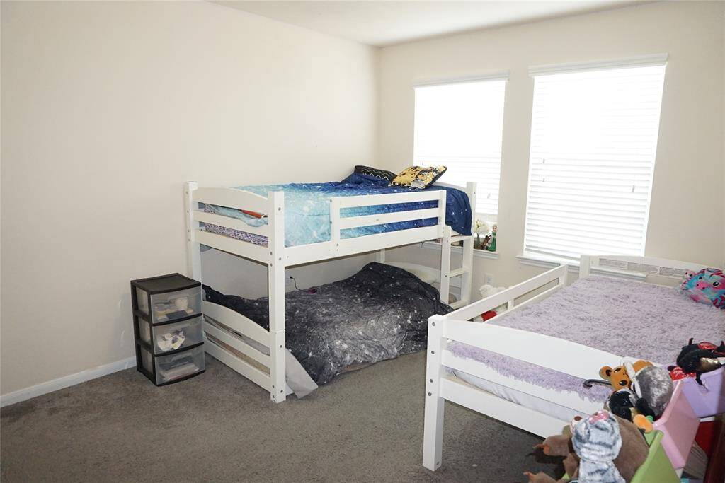 The other secondary bedroom (approximately 13 x 10) will fit 3 beds as shown in this picture.