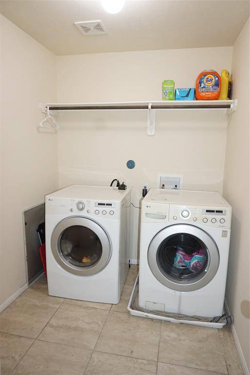 Generously sized utility room upstairs.