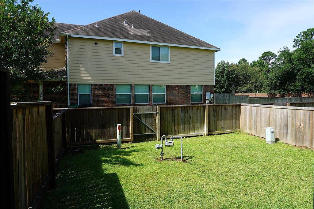 Backyard with gate access to a greenbelt to shorten your walk to the community pool.