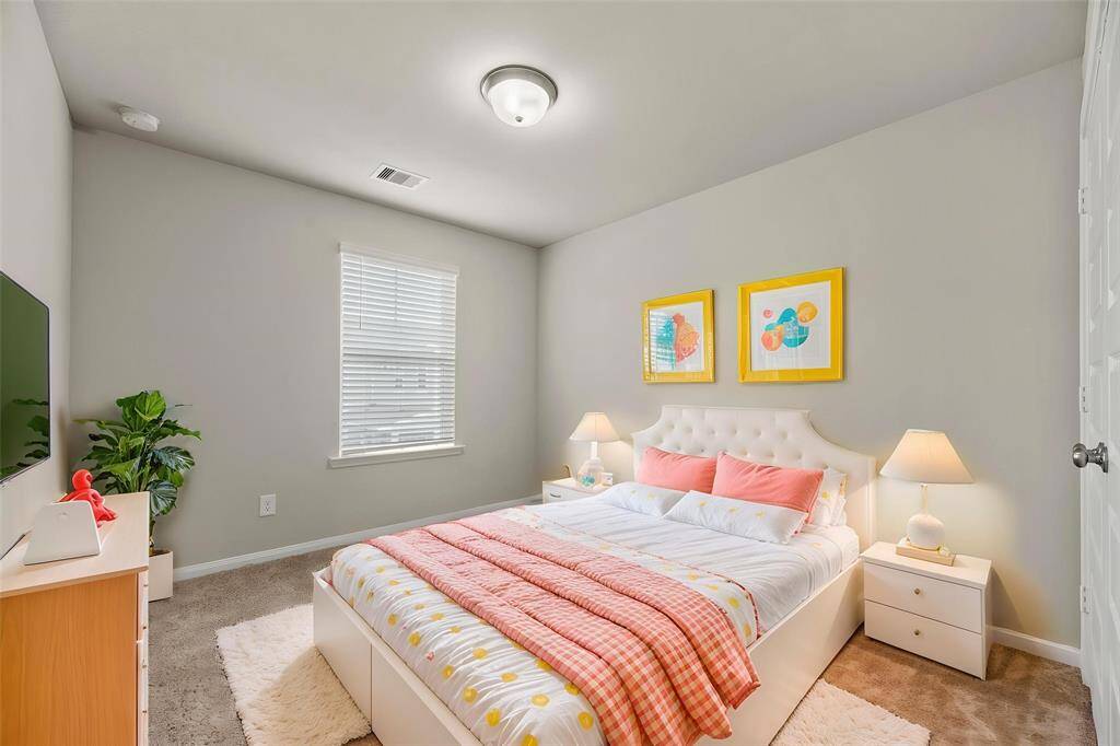 Your second bedroom offers a generous and inviting space that exudes comfort and versatility. - virtually staged