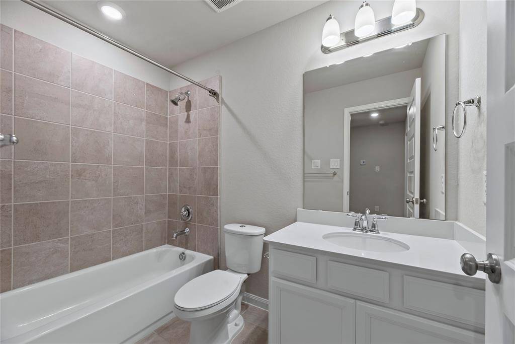 The secondary bathroom is stylishly appointed and thoughtfully designed for comfort and convenience.