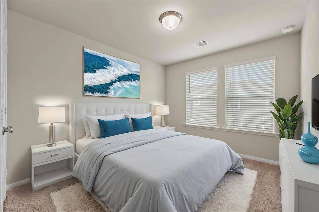 The thoughtfully designed layout of your third bedroom allows for natural light to flood the room, creating a warm and welcoming atmosphere. - virtually staged