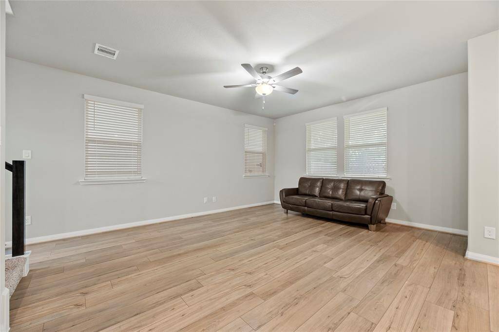 The expansive living area is perfect for relaxing with family, entertaining guests, or creating your ideal gathering space.