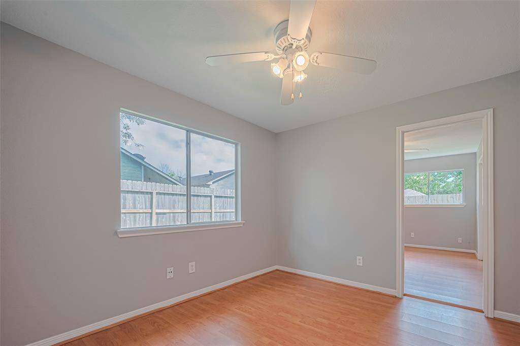 A soft palette, ample natural light, and thoughtful design make this room versatile—perfect for rest, work, or creativity. Complete with ceiling fan, closet, and smooth flooring.