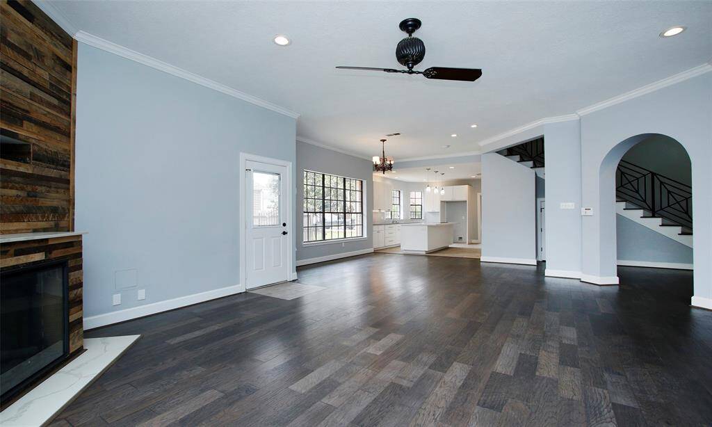 A view from the family room offers a glimpse of the kitchen; that closed door leads to the backyard for easy outdoor access.