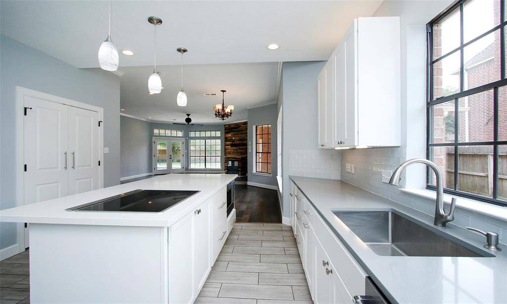 It boasts stunning granite and quartz countertops, offering both durability and modern elegance.