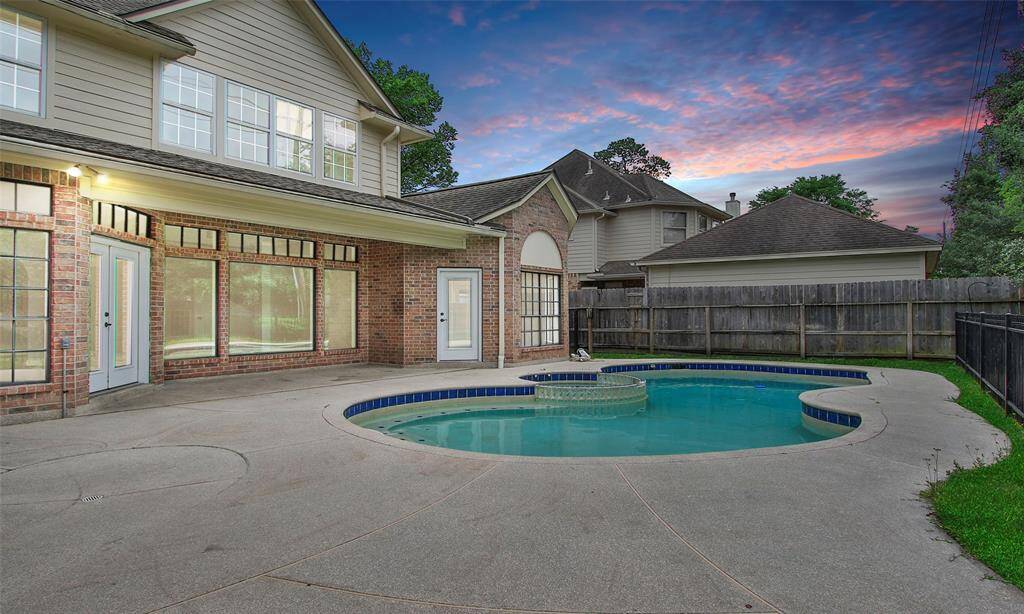 This charming home features a private backyard oasis with a sparkling pool, perfect for relaxing and entertaining.
