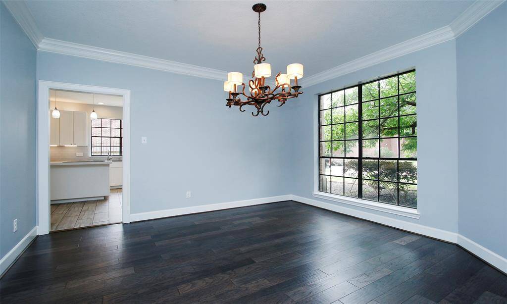 Welcome to the dining room, a spacious and inviting area perfect for family meals and gatherings.