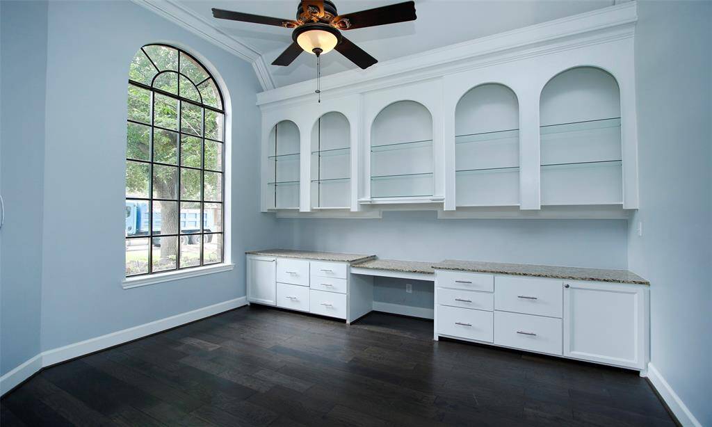 The dining room is conveniently located next to the kitchen. It offers additional cabinetry for storing eating utensils and other essentials.