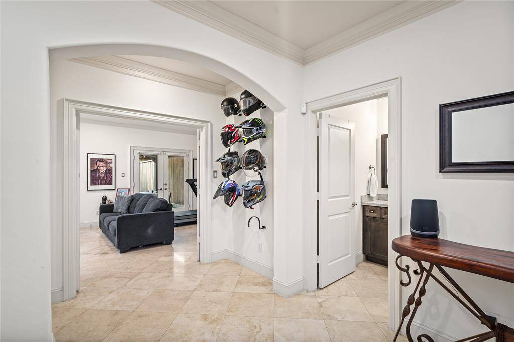First Floor foyer to downstairs room and bathroom on the right